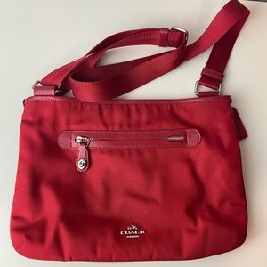 Red Coach vinyl crossbody bag